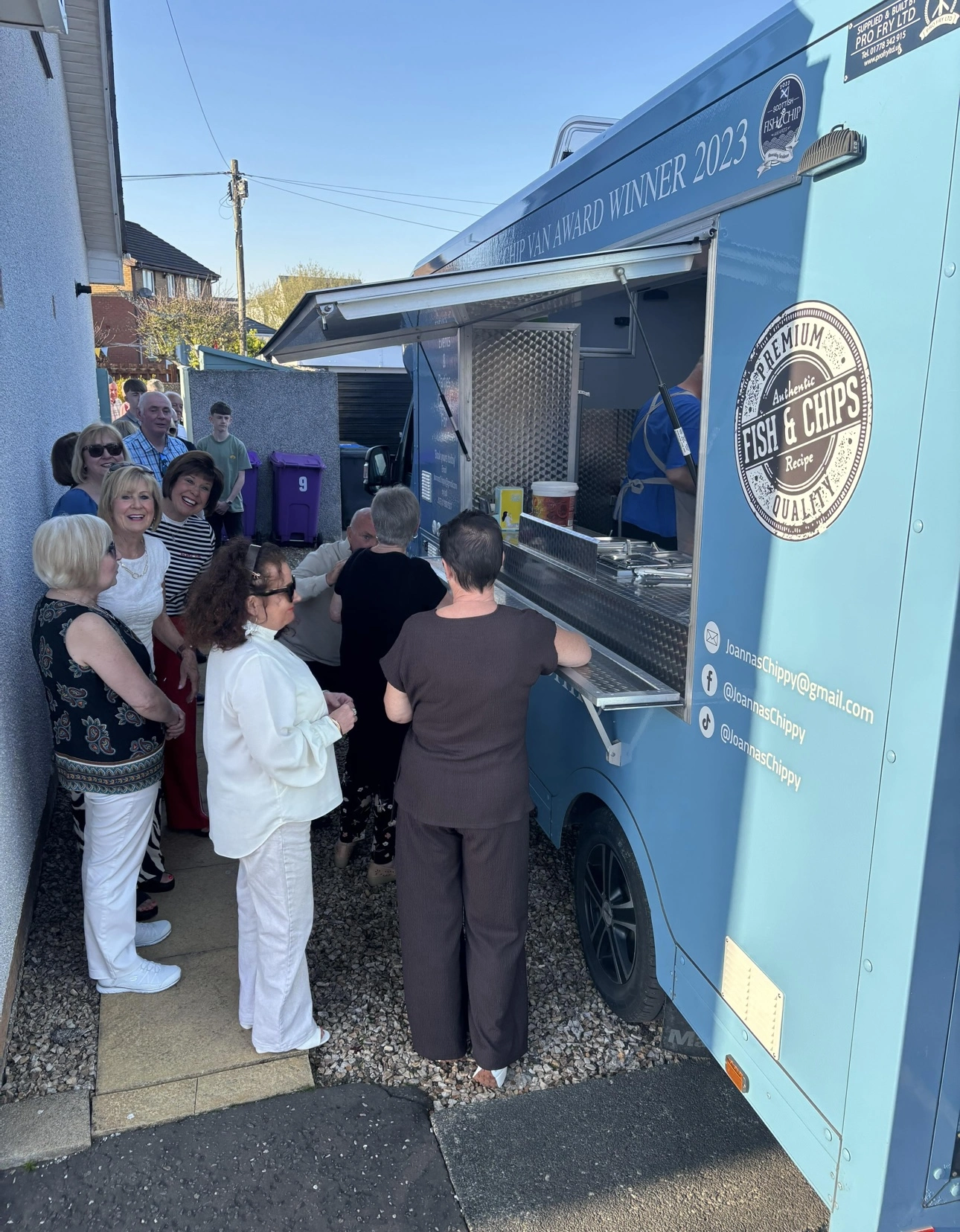 Guests being served from Joanna's Chippy Van at a private party